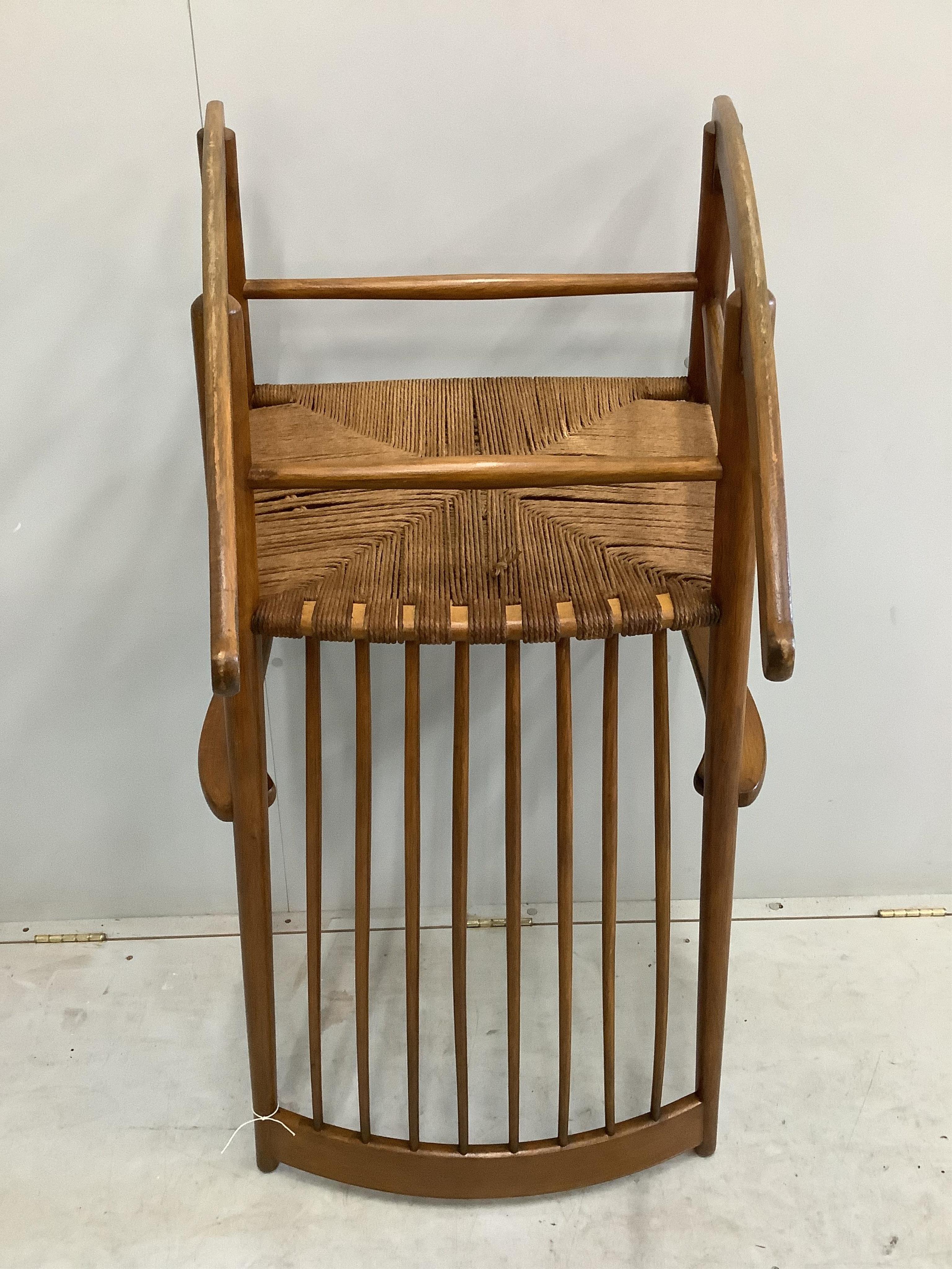 A Hans Wegner style rocking chair, width 63cm, height 106cm. Condition - fair